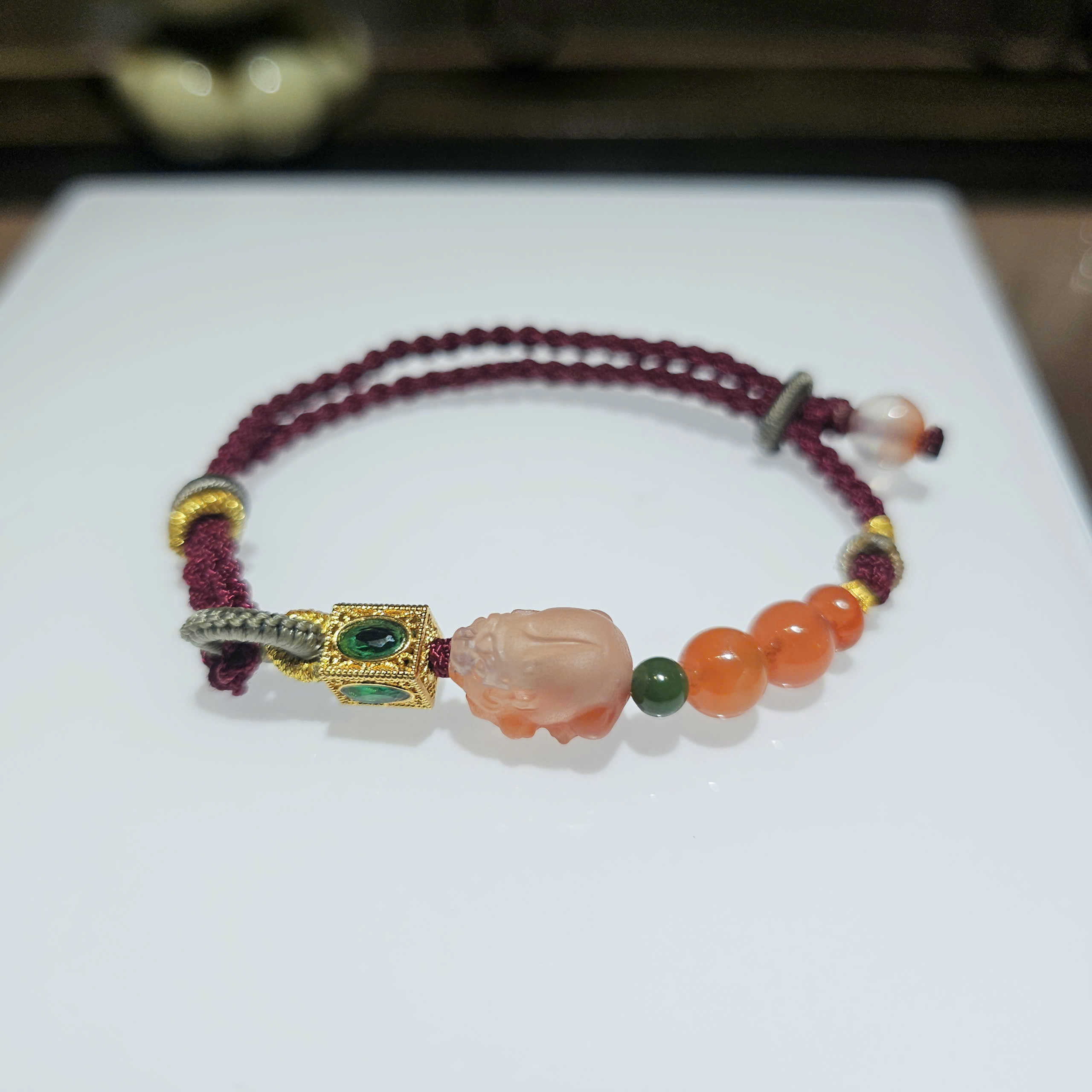Vòng tết tỳ hưu Nam Hồng Tứ Xuyên và charm 18k